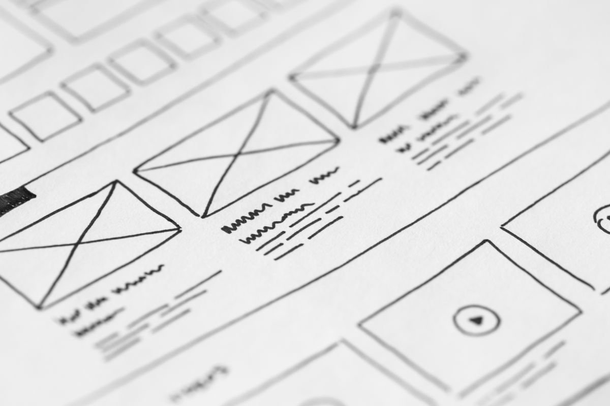 Website UI/UX Design 3 Hand-drawn wireframe design on paper