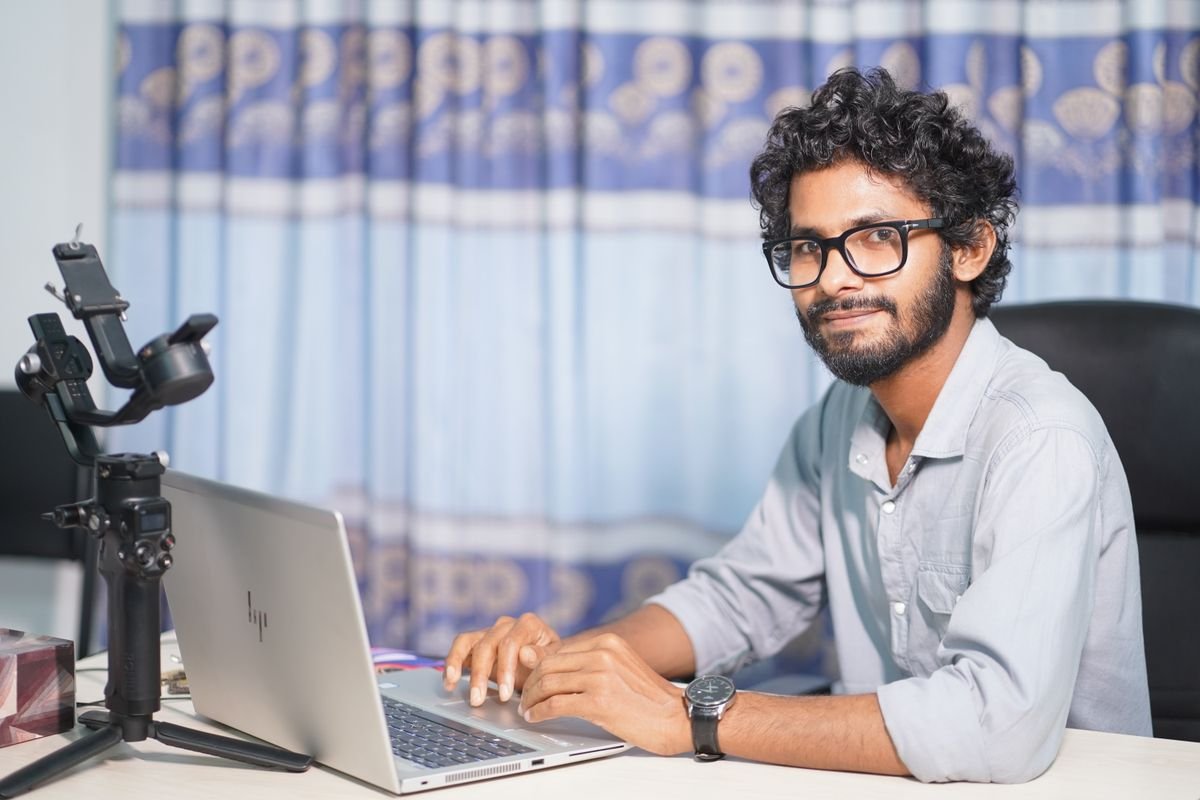 WordPress Troubleshooting and Bug Fixes 1 Web developer working on a laptop in an office