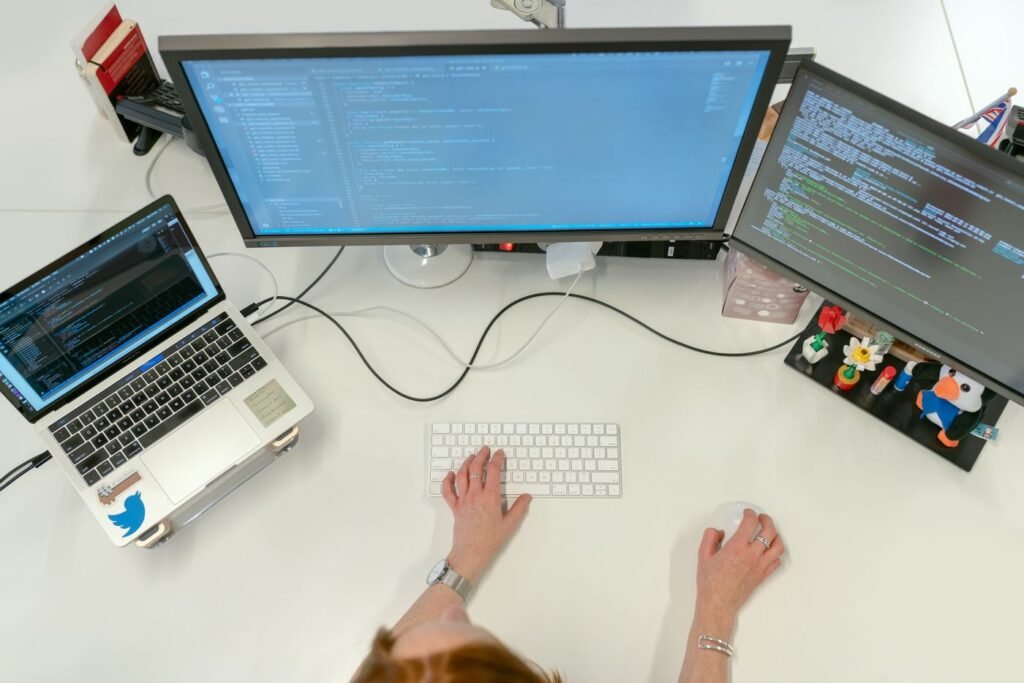 Reviewing a website development project on a laptop
