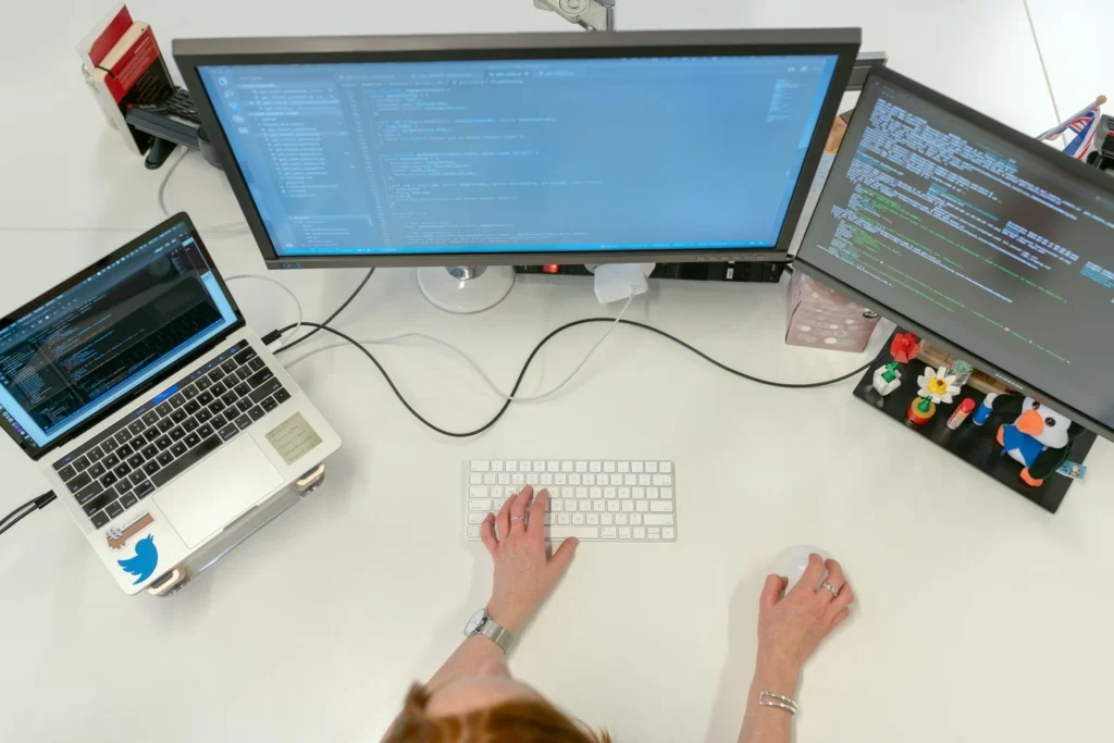 Reviewing a website development project on a laptop