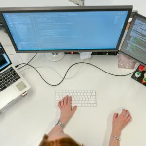 Reviewing a website development project on a laptop